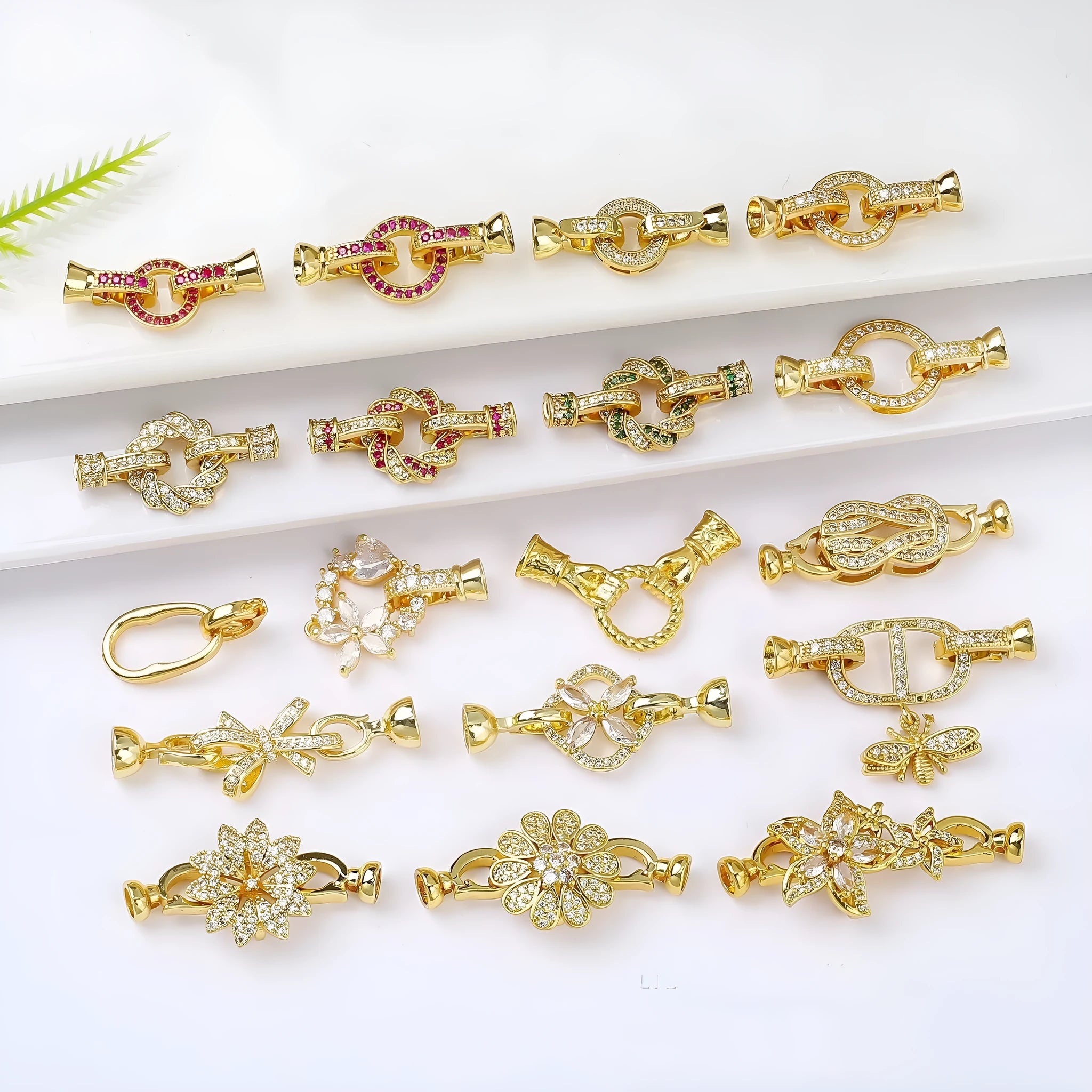 Small gold electroplated chain buckle clasp for DIY jewellery making on white background