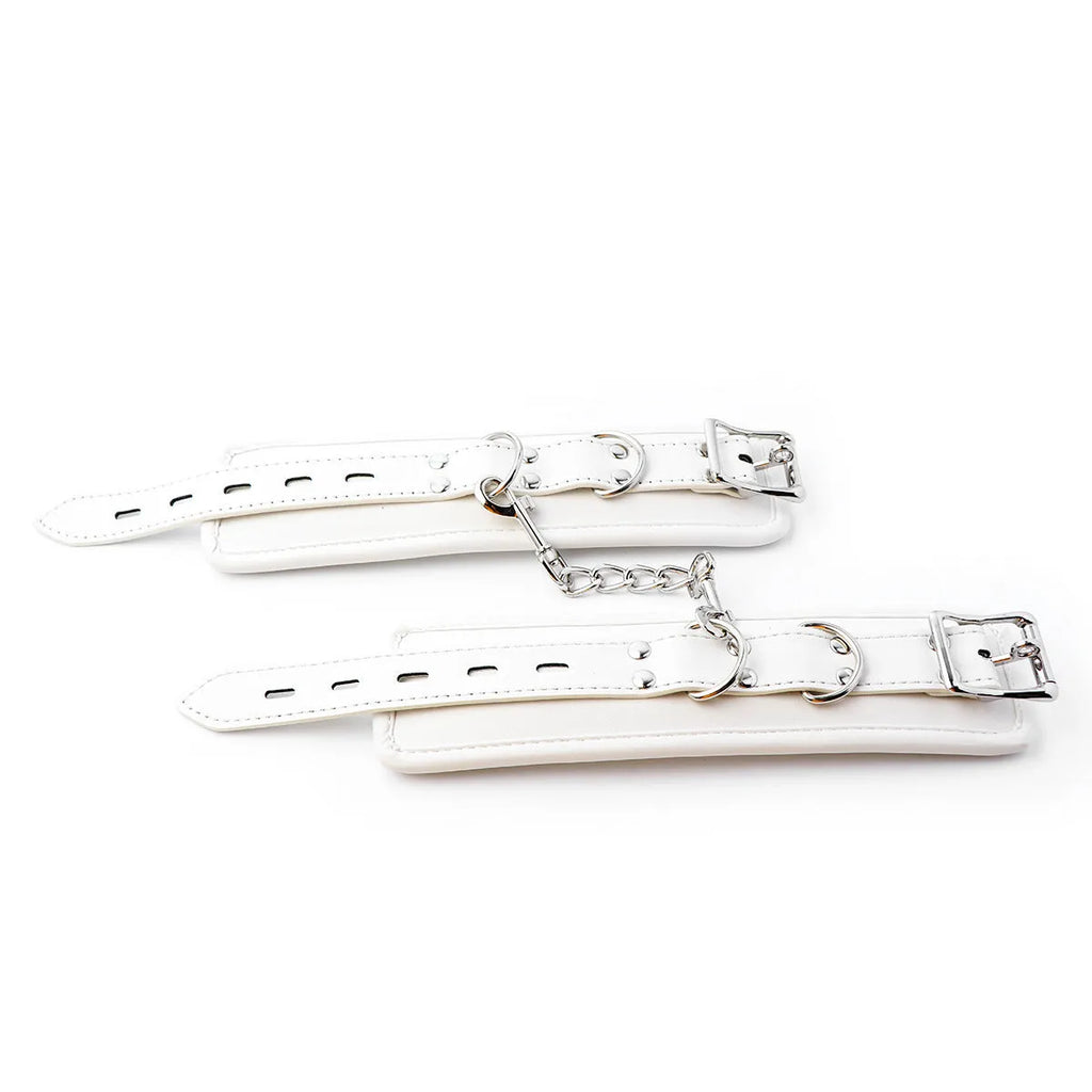 White PU sponge bondage set showing handcuffs, foot cuffs and neck scarf for restraint play