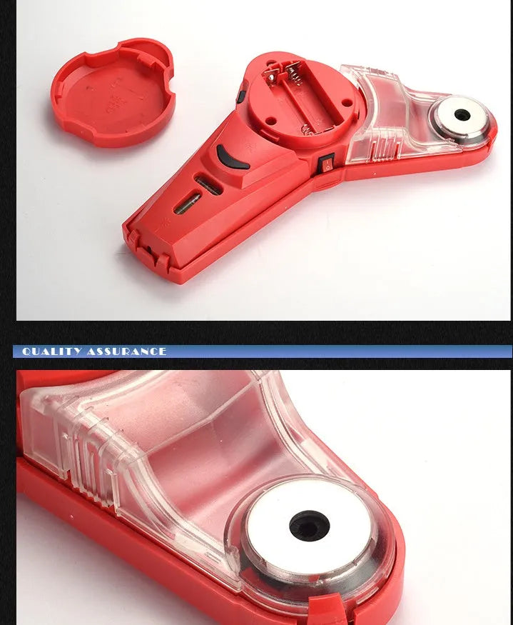 Red portable infrared laser level with punching function on a wooden workbench.