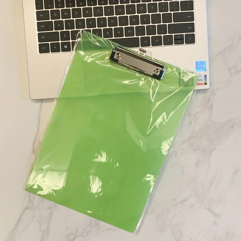Transparent A4 plate writing board holder with metal clip, shown in blue colour on a desk.