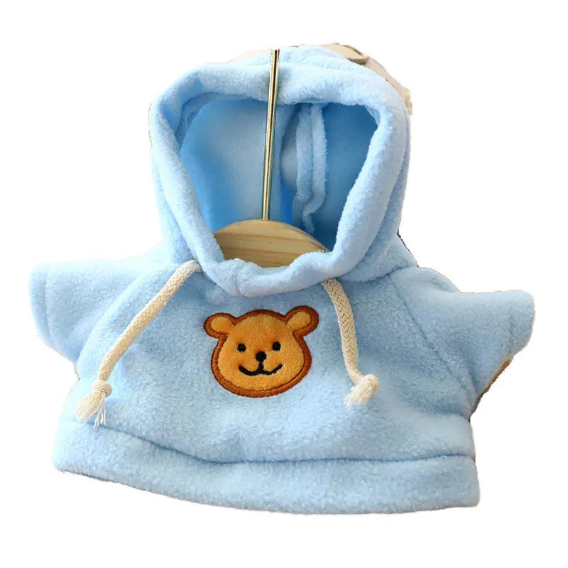 A blue cloth hoodie sweater for a small dog, showing the hood up.