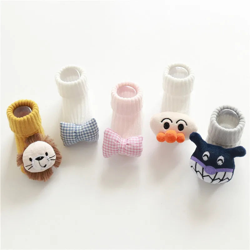 Cotton baby floor socks with non-slip soles in a pink bow print design.