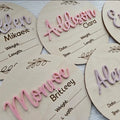 15cm square plywood baby name sign with birth details in one of three available style variants