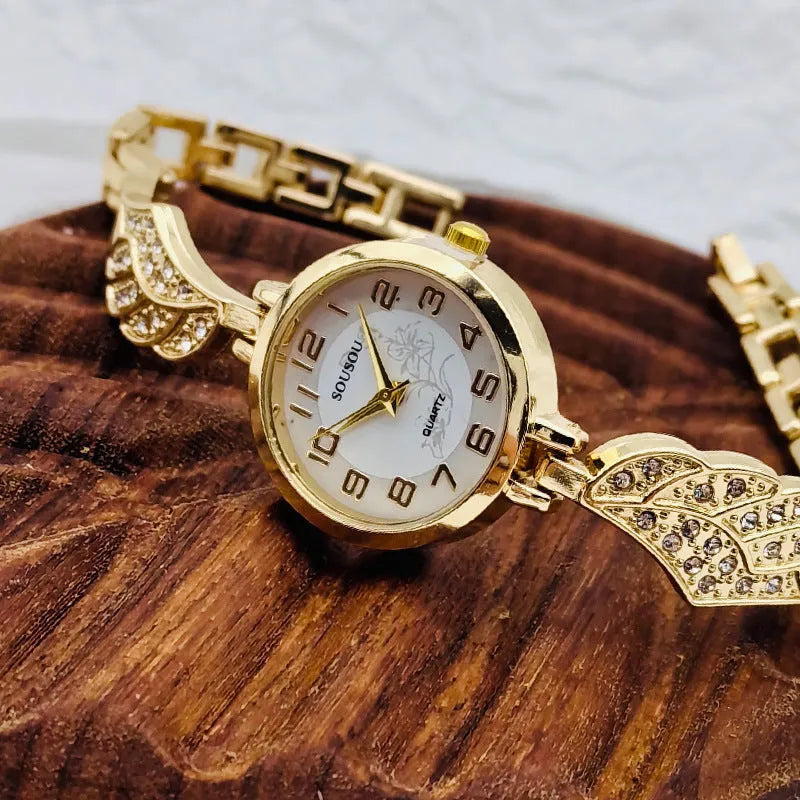 Women's stainless steel watch with round gold surface dial and vachette clasp