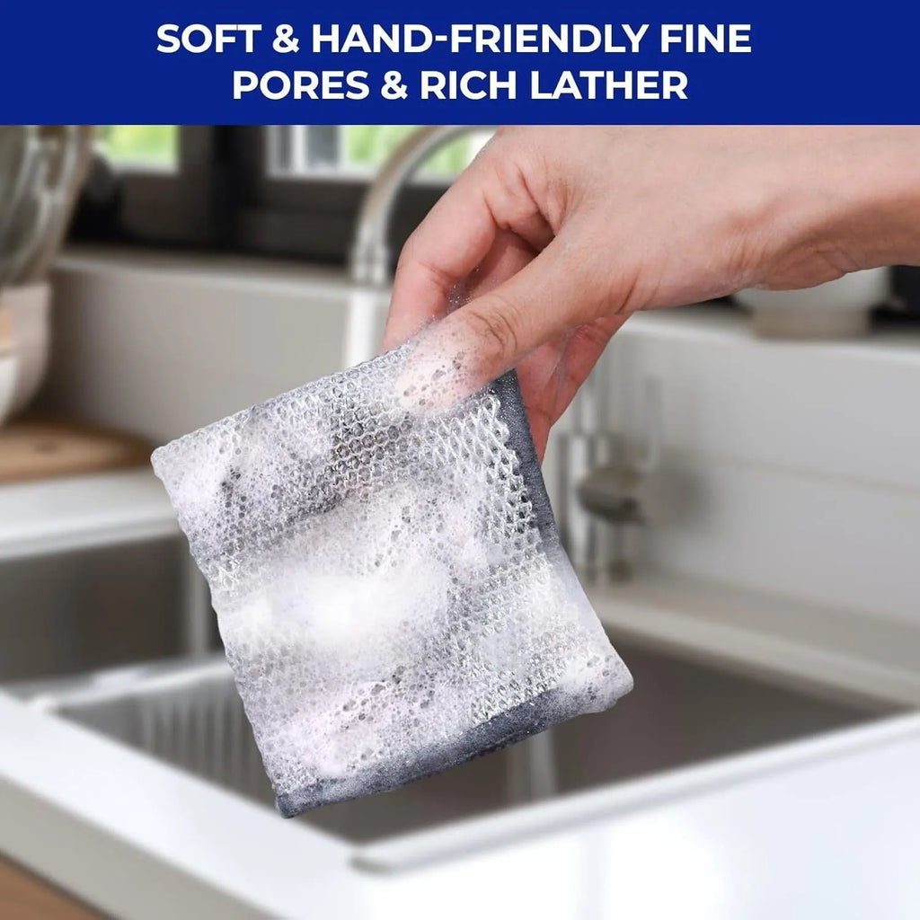 Silver microfiber cleaning rag with a built-in steel wire scrubber ball on a kitchen counter.