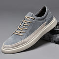 Men's grey casual skate shoes with pigskin upper and rubber sole, shown with front lace-up design and round toe