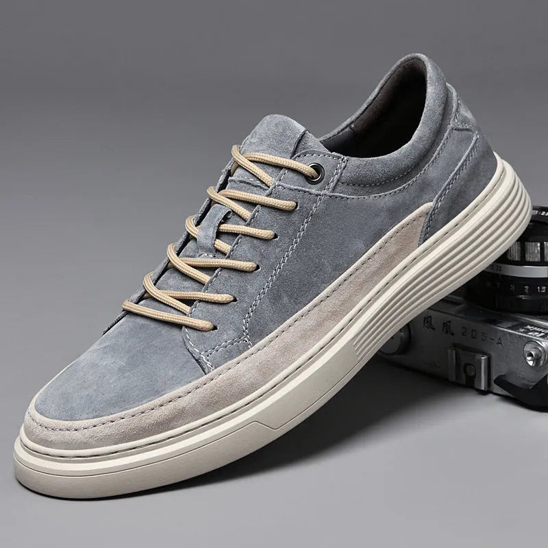 Men's grey casual skate shoes with pigskin upper and rubber sole, shown with front lace-up design and round toe