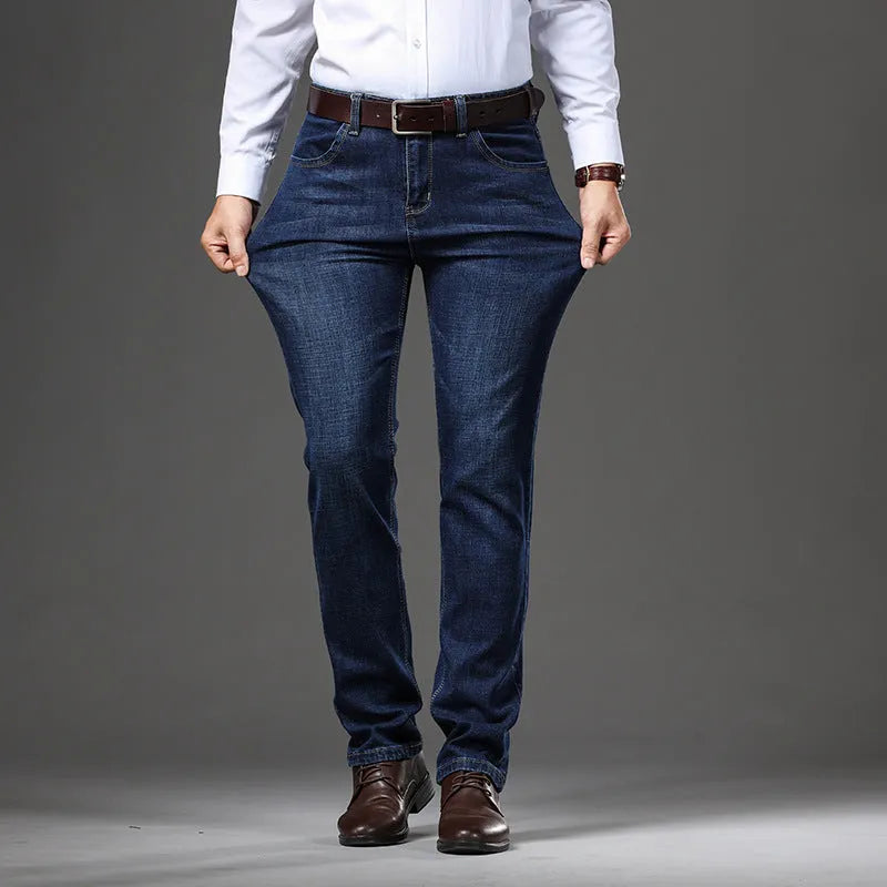 Women's straight leg stretch jeans in K276 blue denim, shown in a loose fit on a model.