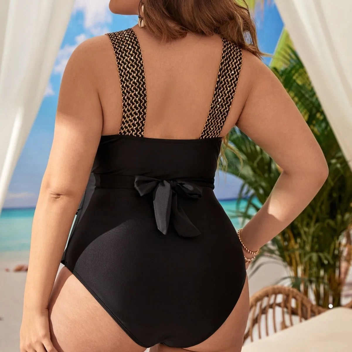 Women's sleeveless one-piece swimsuit with chest pad in a dark colour.