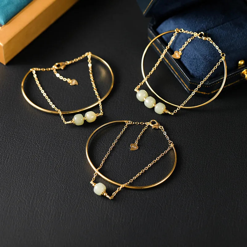 Women's jade lucky beads bracelet with gold inlay in single, double, and three bead versions.