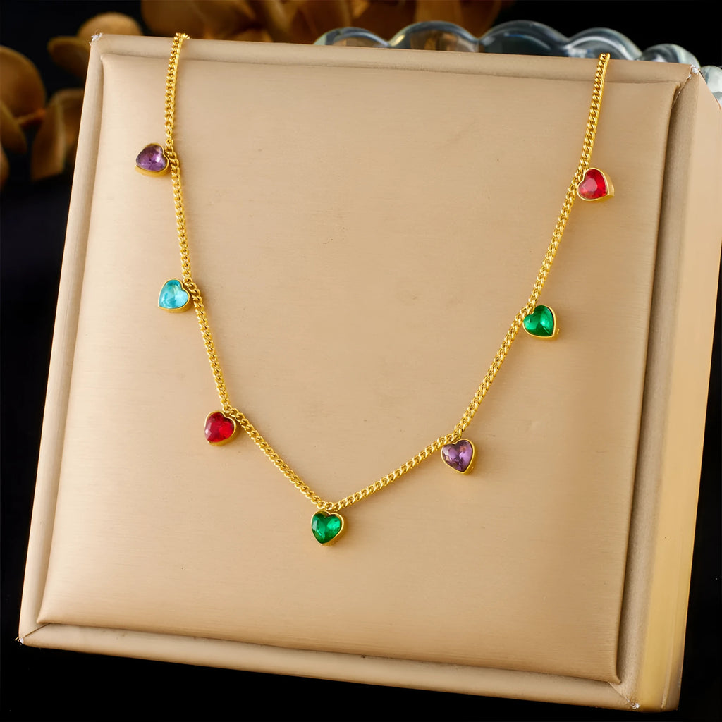 Gold heart pendant necklace on a stainless steel chain with adjustable length.
