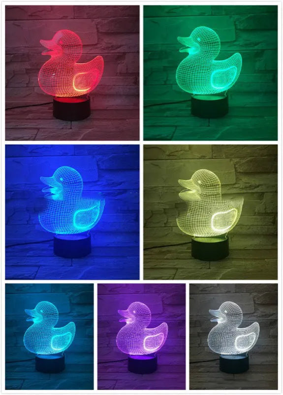 Little yellow duck 3D night light showing seven colour options and remote control on a desk