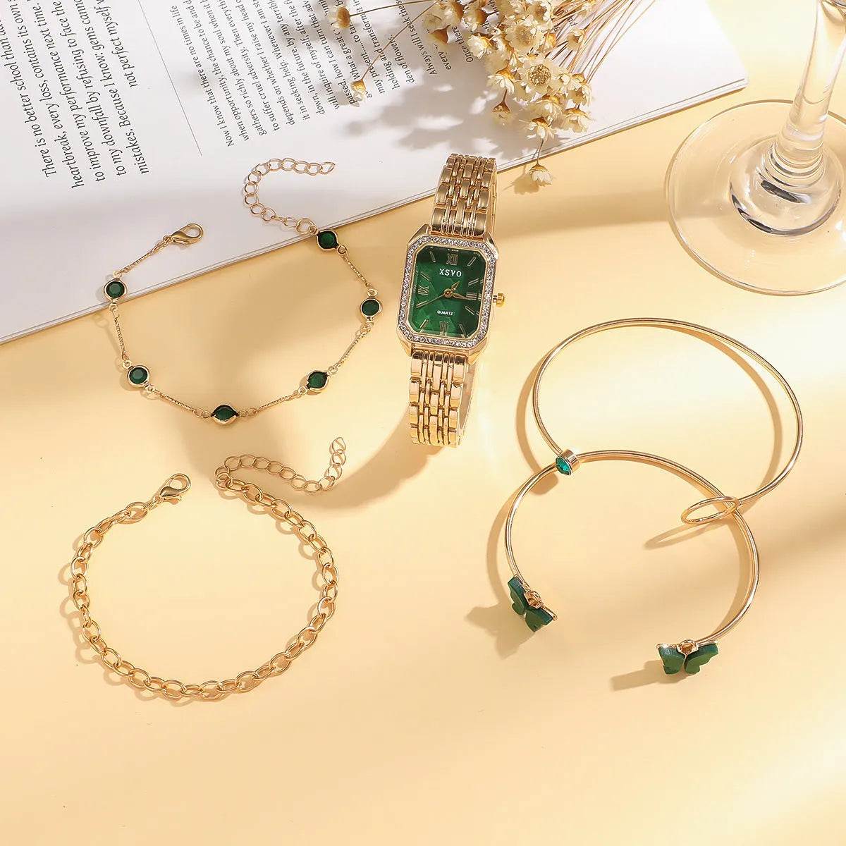 Women's gold green square watch with four matching bracelets in gift set packaging
