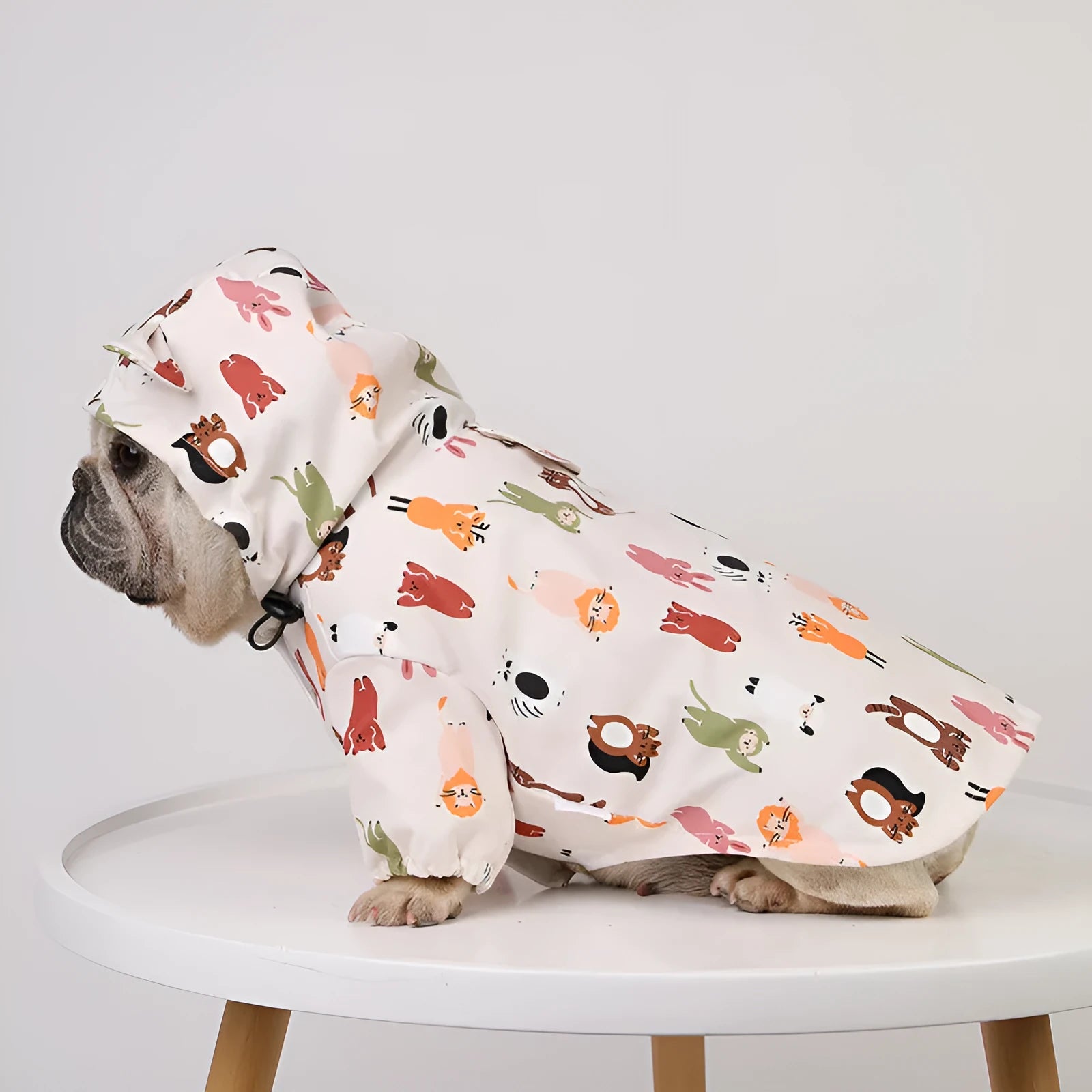 Beige cartoon pattern dog raincoat with double waterproof coating, shown in size L.