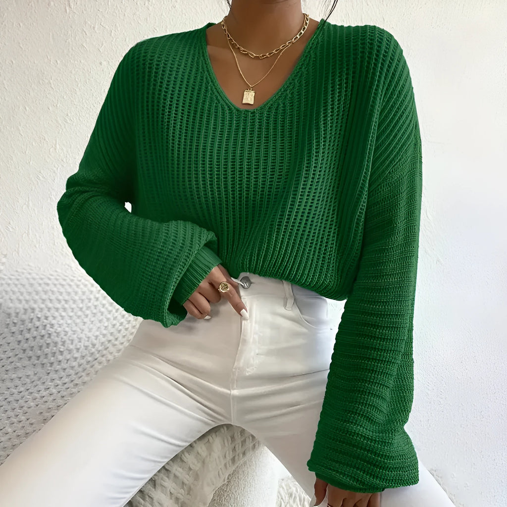 Women's solid colour long sleeve pullover in loose casual fit, shown in available colour options.