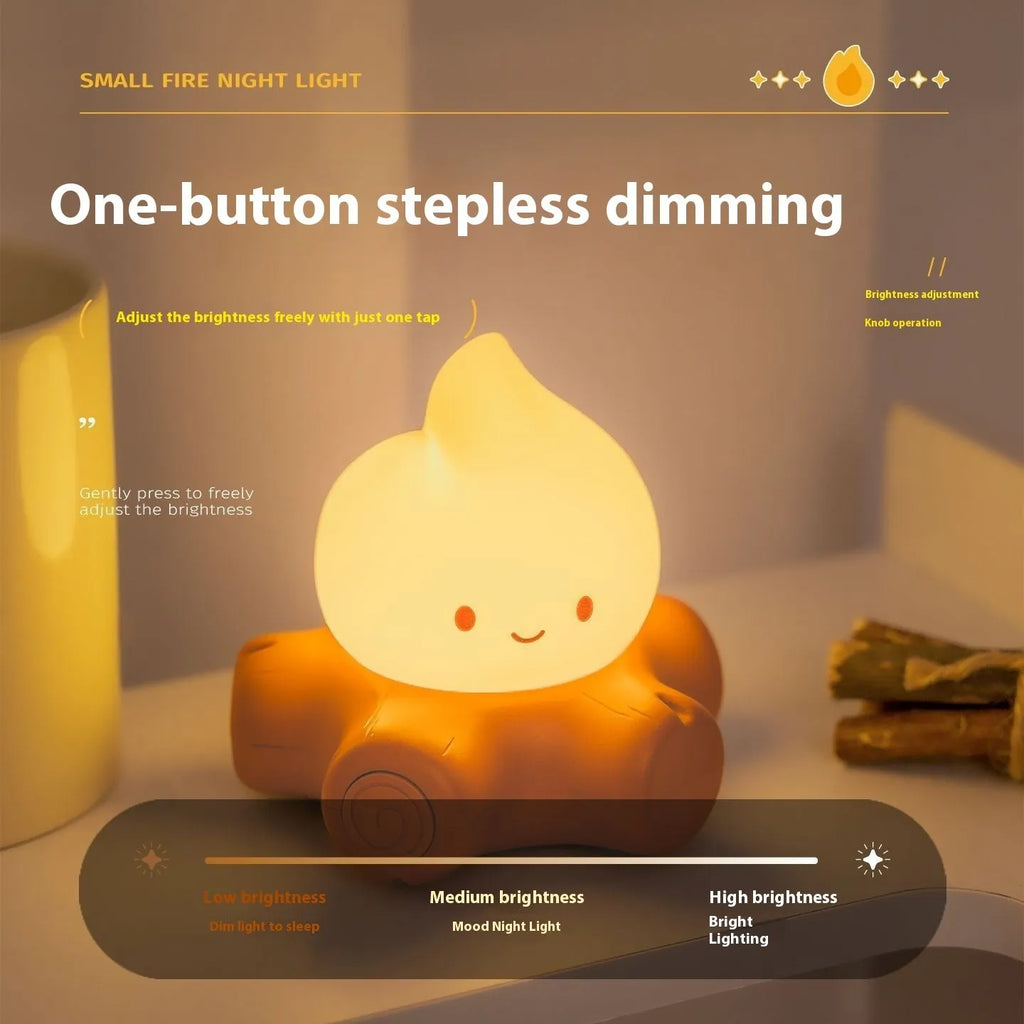 Small cartoon-style night lamp with silicone flame simulation on a table
