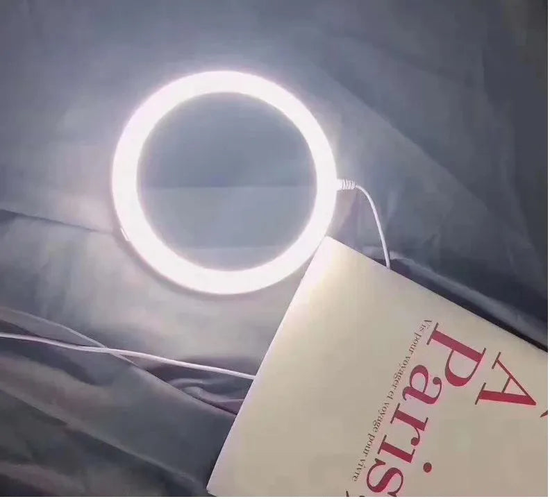 White foldable LED vanity mirror showing 1x and 5x magnification sides and USB charging port.