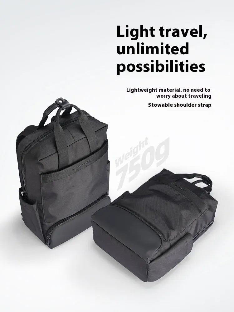 Elegant black Oxford cloth computer backpack showing main compartment and straps