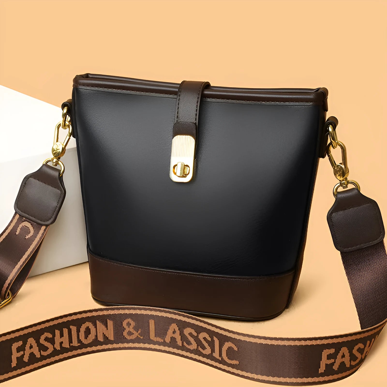 Korean style soft PU bucket messenger bag with double shoulder straps in black colour showing sandwich pocket and sewing thread details