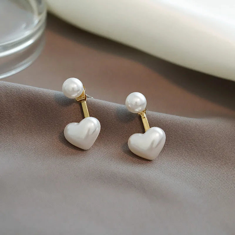 Heart-shaped pearl stud earrings with electroplated alloy construction and Korean-style design