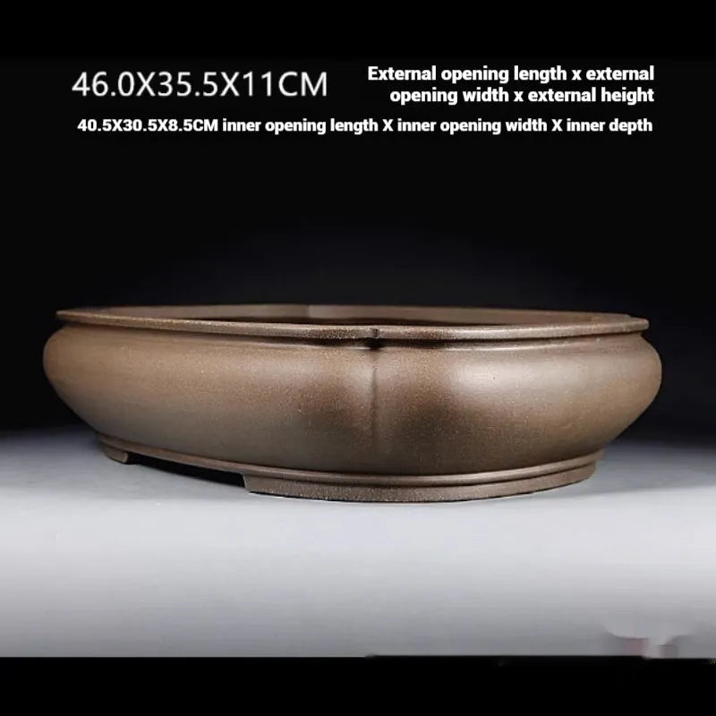 Handmade antique purple clay papaya-shaped flower pot shown from side displaying dimensions.
