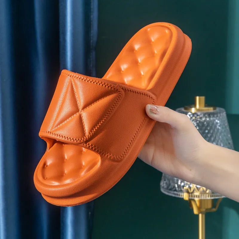 Pair of soft EVA bathroom slippers with a thick non-slip sole, shown in a choice of colours.