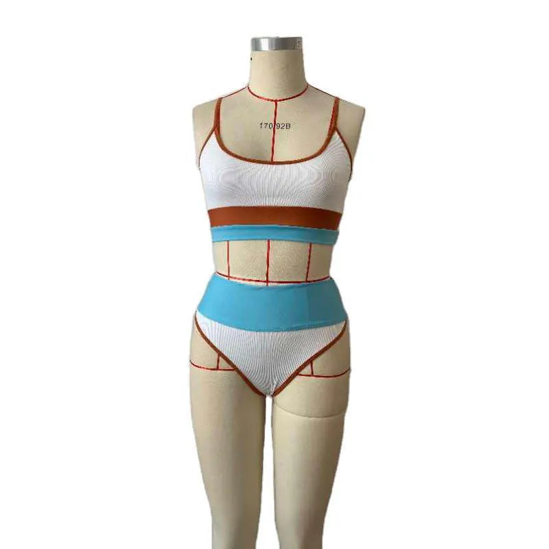 Women's solid colour quick-dry swimwear set with a top and shorts for swimming.