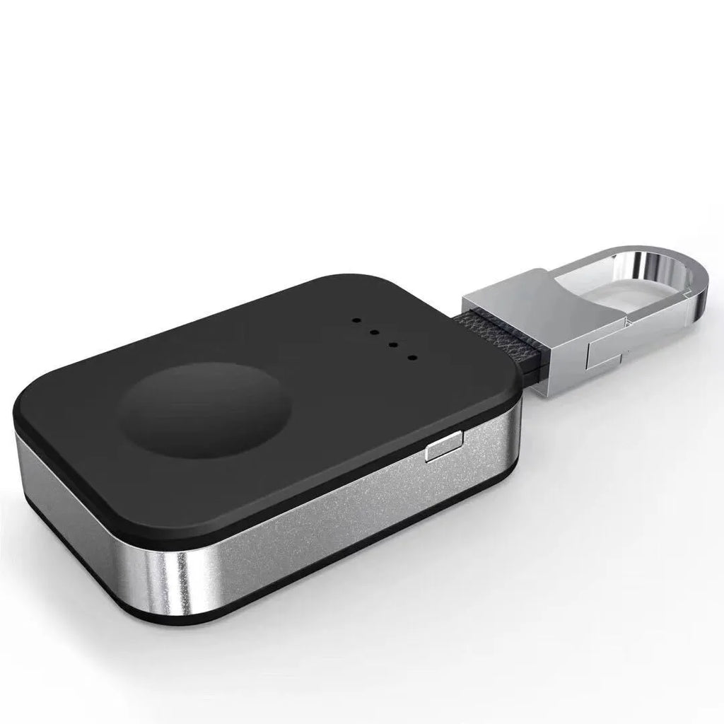 Black Apple Watch portable wireless power bank on a keyring showing compact size