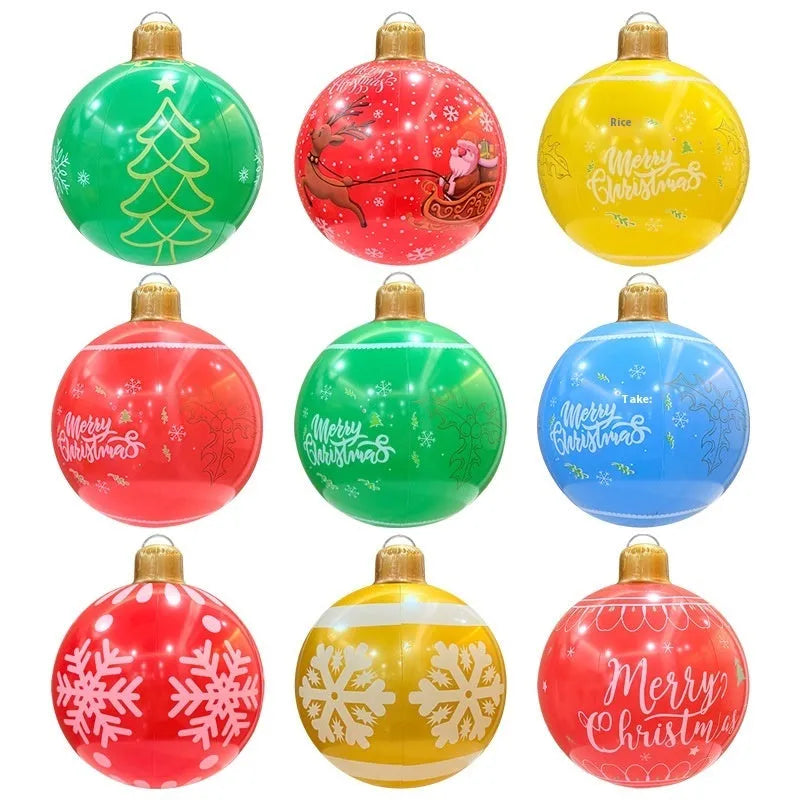 Large red and white inflatable Christmas ball with flashing lights standing in a garden.
