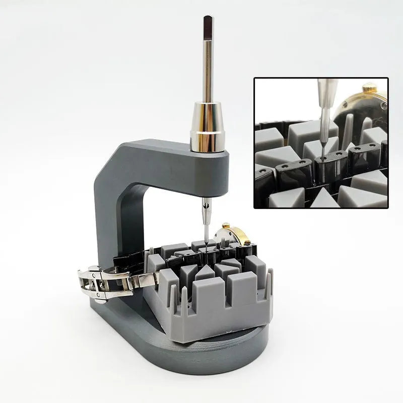 Silver multi-purpose press strap removal tool with a pointed blade for watch and jewellery repair.