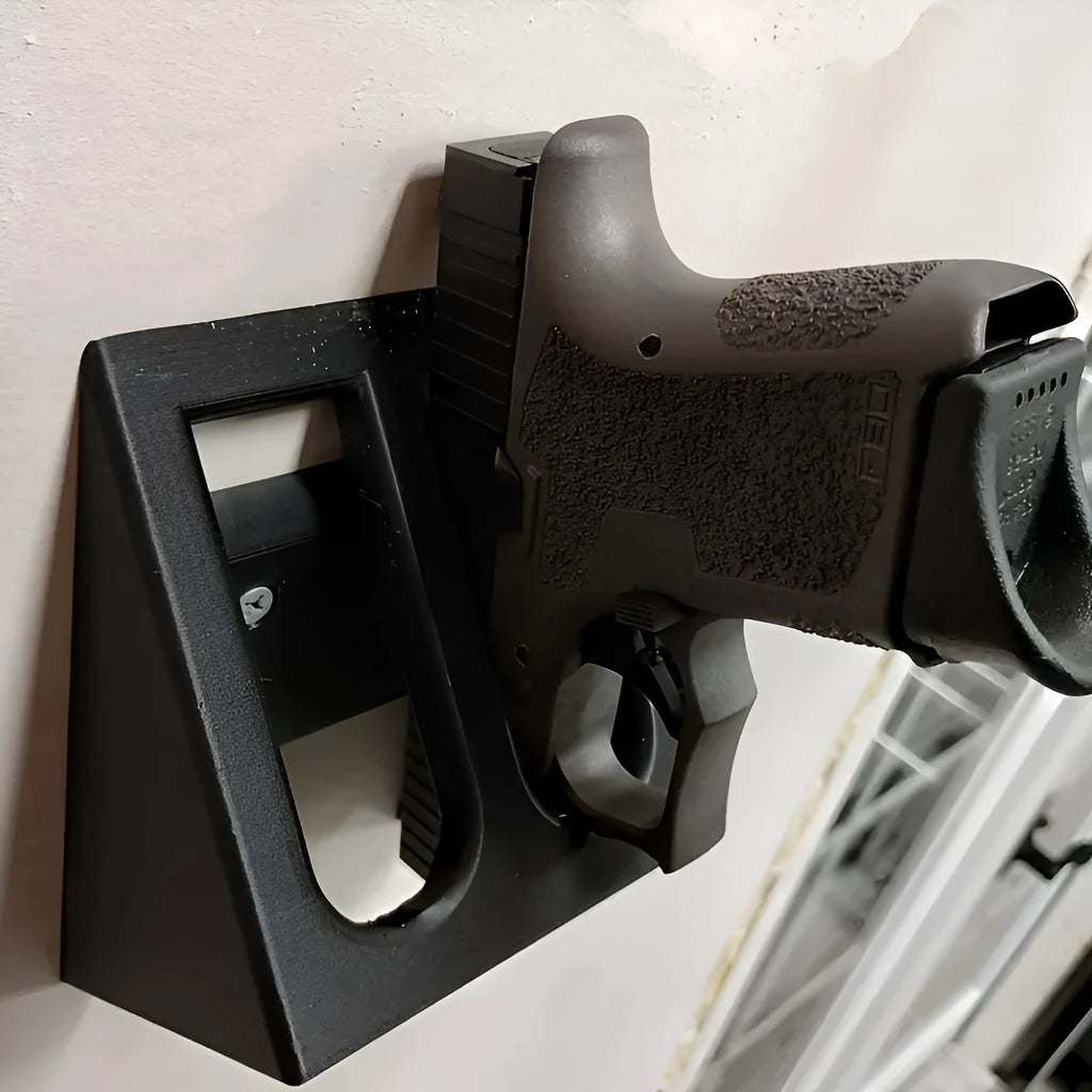 Black plastic pistol display stand with a punk-style design for gun replicas.