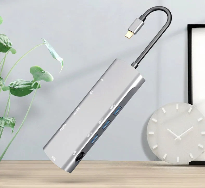 Grey aluminium USB-C docking station with HDMI, VGA, USB port, and a 140mm cable.