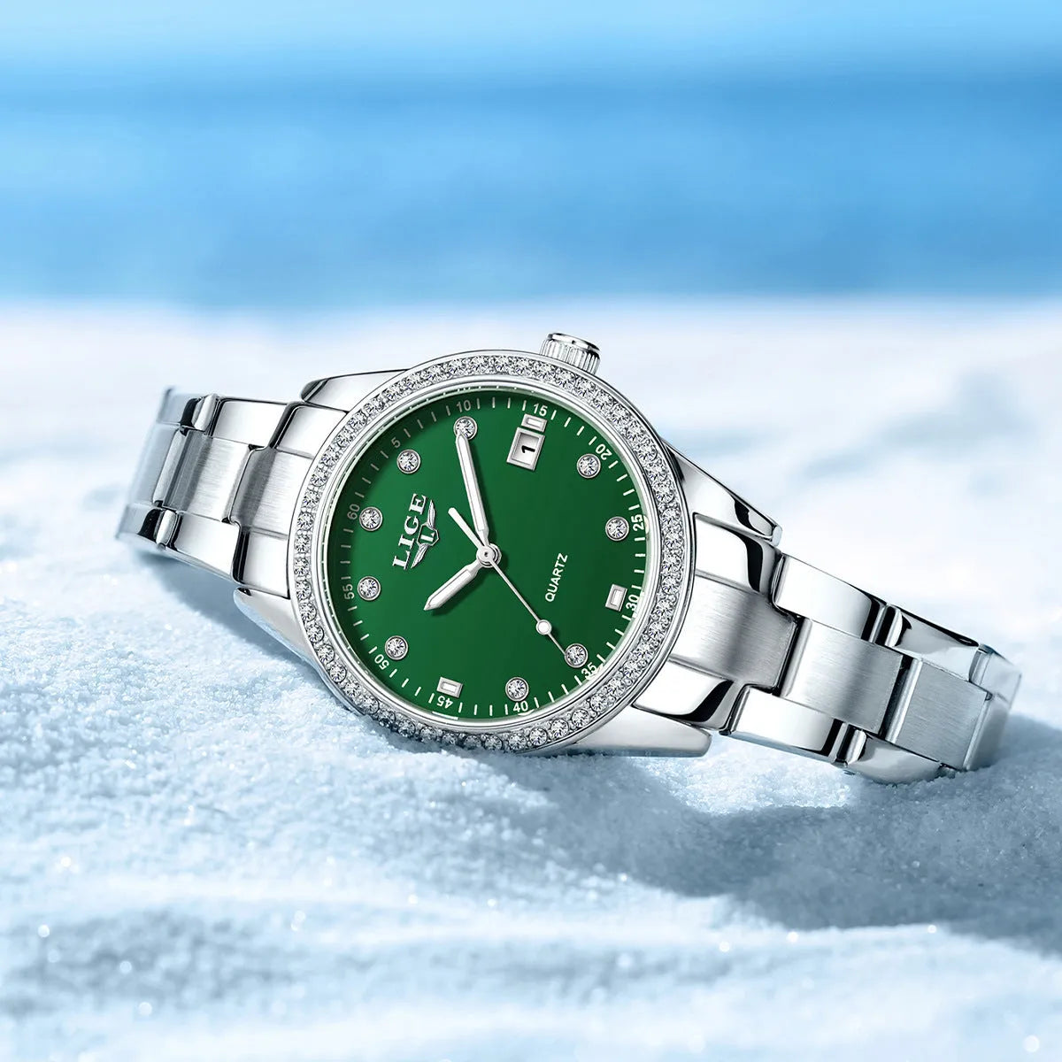 Women's silver fashion watch with diamond-encrusted bezel and luminous hands on 34mm stainless steel case