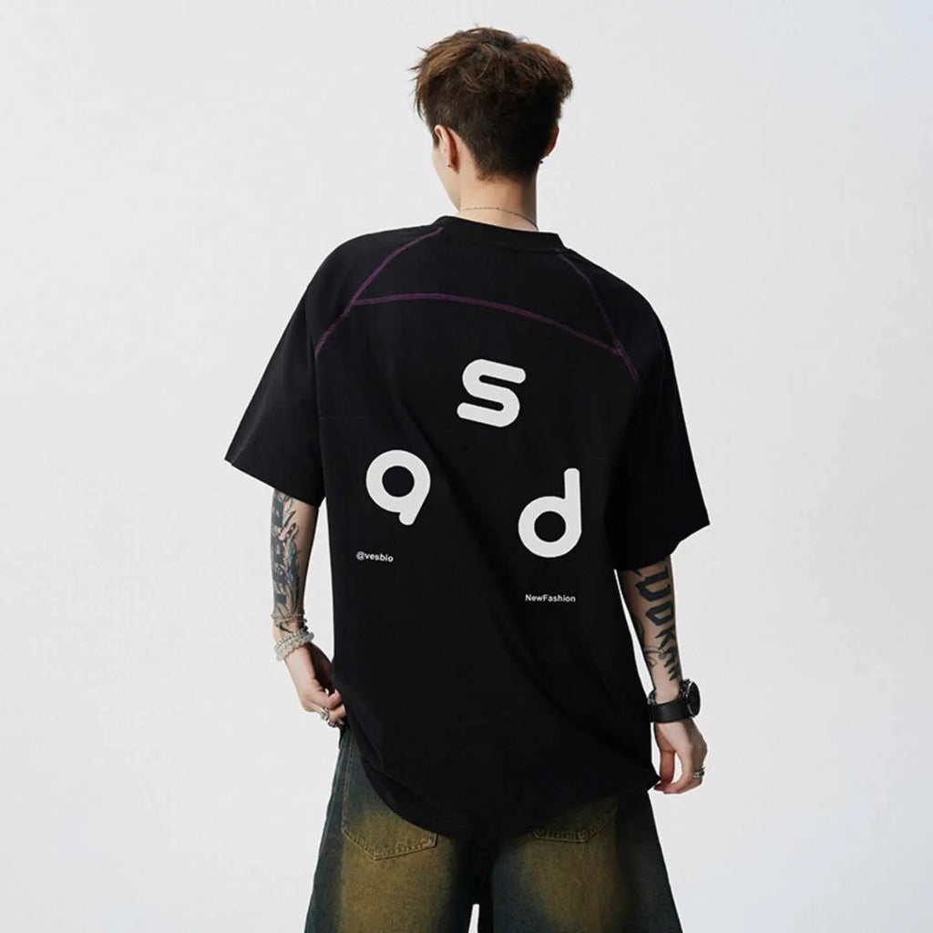 Loose fit black cotton t-shirt with white letter print, short sleeves, and round neck.