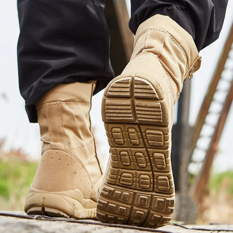 Yulong combat tactical desert boots in black and sand colour on a rocky outdoor background.