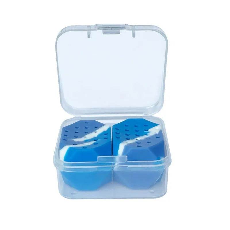 Two transparent silicone jaw exercise balls with camouflage patterns for masseter training