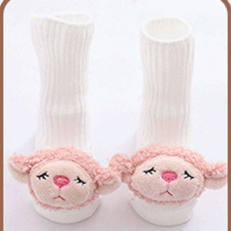 Cotton baby floor socks with non-slip soles in a pink bow print design.