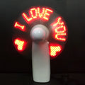 White handheld mini fan with LED love pattern display showing blue and red colours