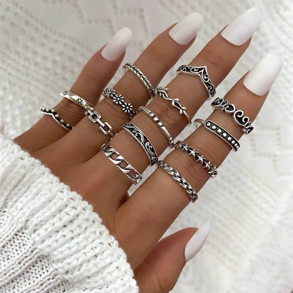 Alloy ring set with butterfly and snake retro geometric designs on display
