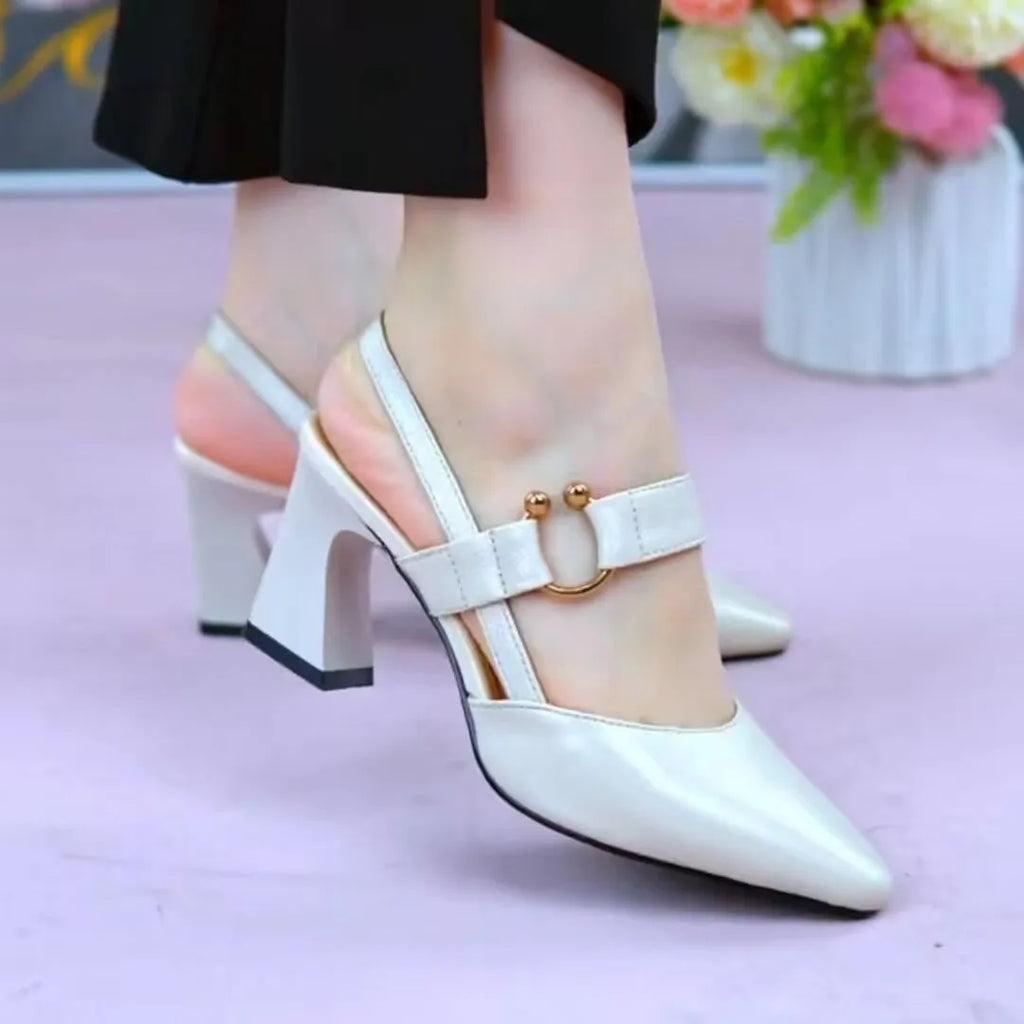 Women's apricot coloured leather sandals with a chunky high heel, closed toe, and closed back strap.