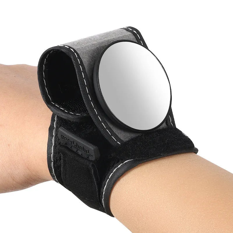 Black nylon wrist-mounted bicycle rear-view mirror with adjustable angle and secure strap for handlebar installation