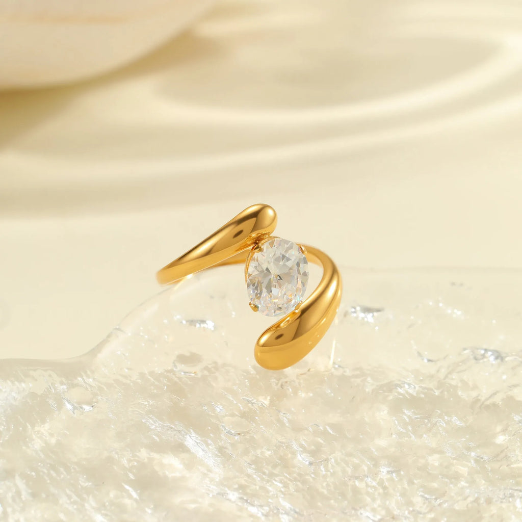 Geometric stainless steel ring with open mouth adjustable design and faceted zircon centrepiece