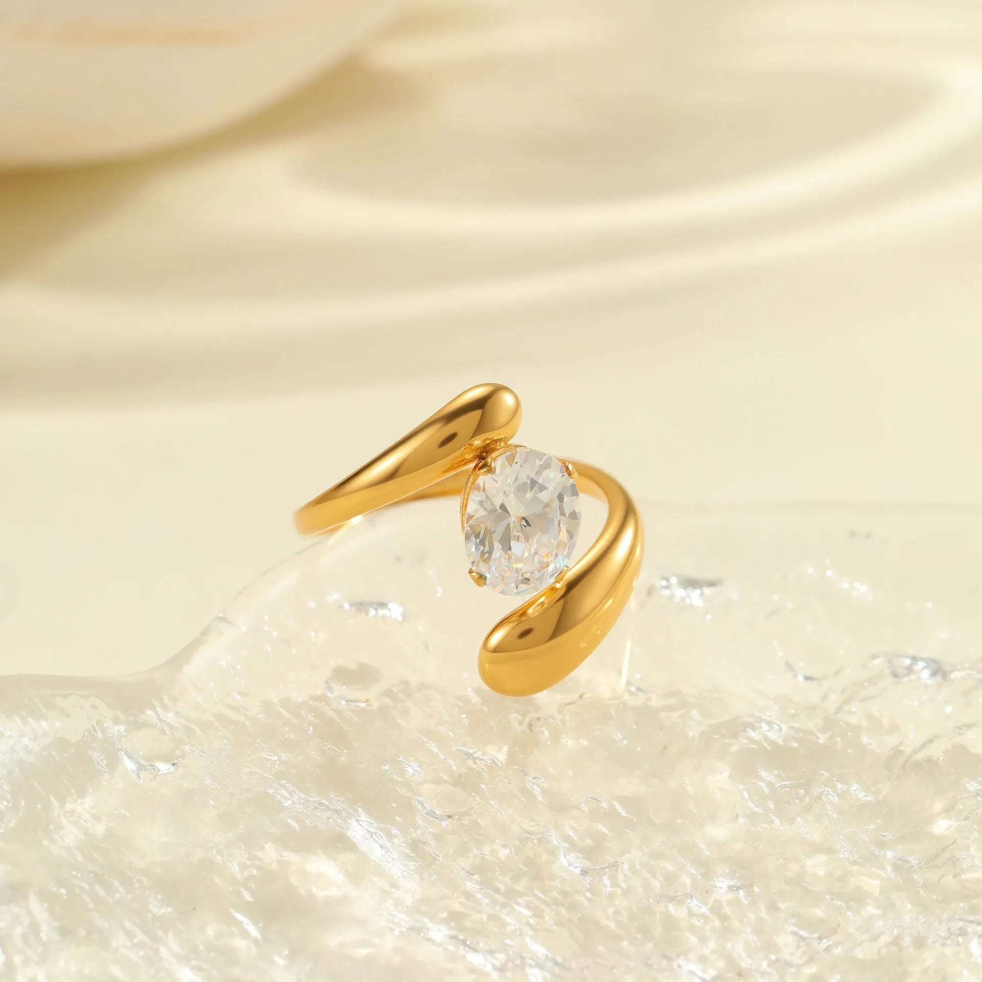 Geometric stainless steel ring with open mouth adjustable design and faceted zircon centrepiece