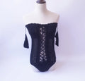 Off-shoulder one-piece swimsuit in white, black, grey, green, or pink.