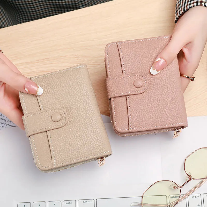 Ladies short wallet with lychee pattern in beige, pink, black and red colour options showing two-fold design