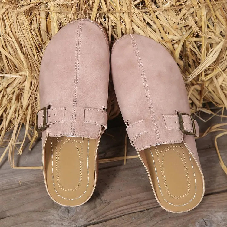 Women's casual wedge slipper in a light brown colour, showing cloth upper and rubber sole.