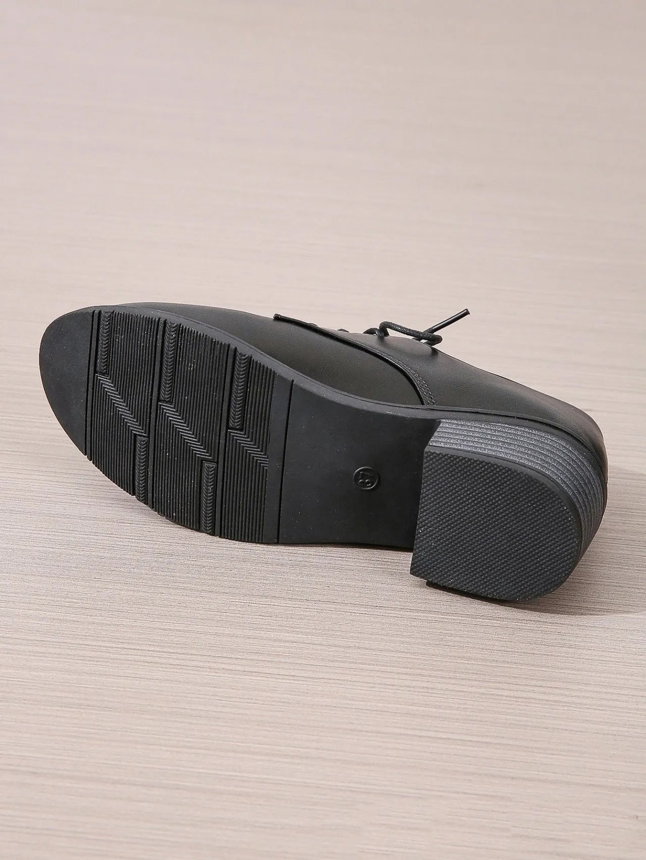 Black women's leather work shoes with thick chunky heel and pointed toe