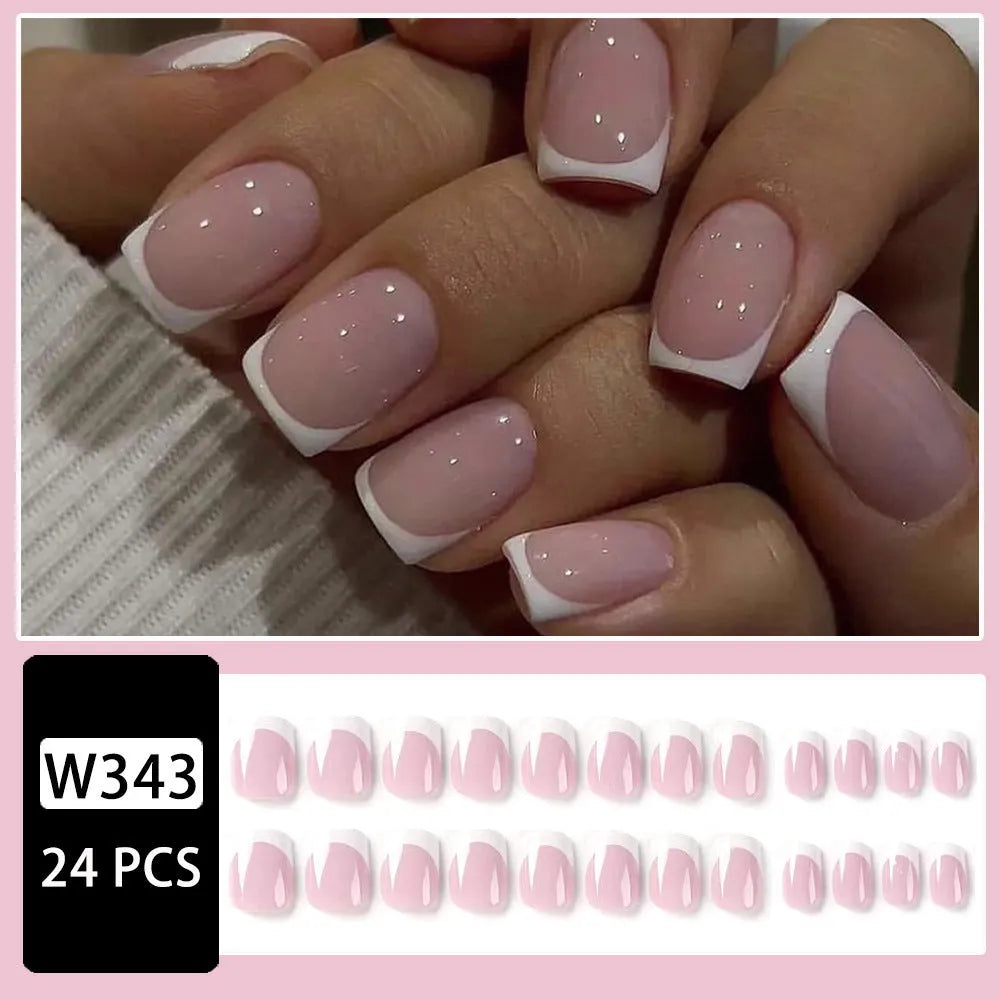 24 white plastic false nail tips with a black and white plaid pattern.