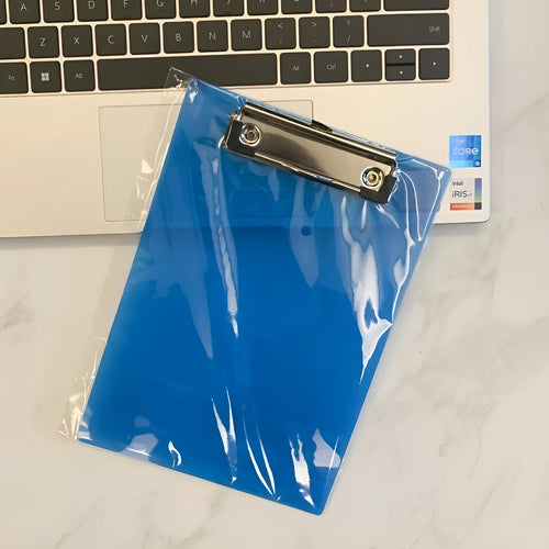 Transparent A4 plate writing board holder with metal clip, shown in blue colour on a desk.