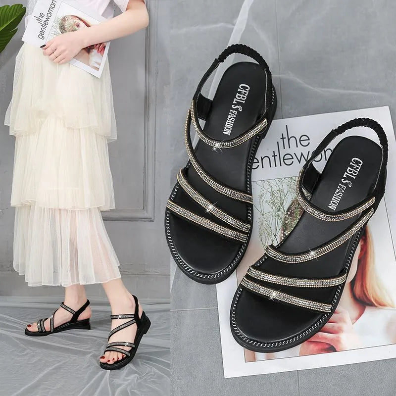 Women's silver flat sandals with round toe, rhinestone decoration, and elastic band strap